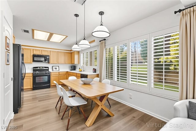 8612 Danza Del Sol Dr, Las Vegas, NV 89128 - dining room featuring light wood-style floors