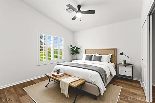 8612 Danza Del Sol Dr, Las Vegas, NV 89128 - bedroom with vaulted ceiling, wood finished floors, a closet, and a ceiling fan