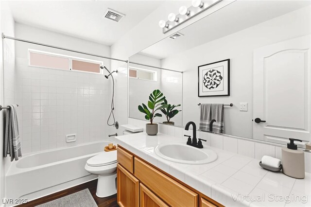 8612 Danza Del Sol Dr, Las Vegas, NV 89128 - bathroom with vanity, shower / tub combination, and wood finished floors