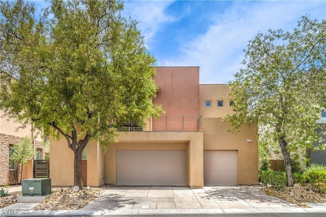 1448 Canyon Ledge Ct, Las Vegas, NV 89117 - southwest-style home featuring an attached garage, stucco siding, and driveway