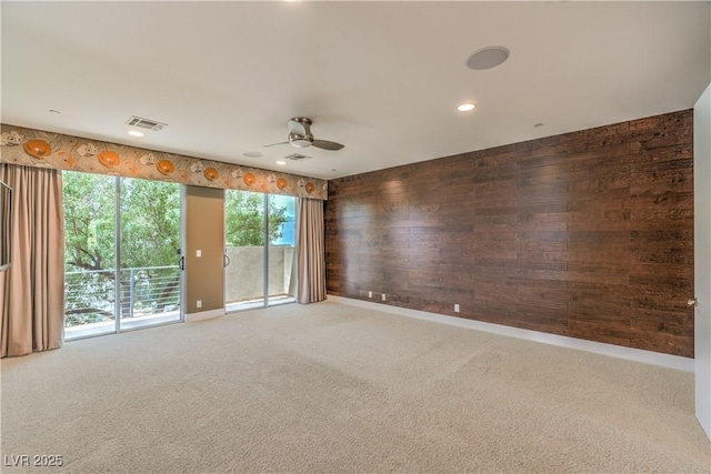 1448 Canyon Ledge Ct, Las Vegas, NV 89117 - carpeted empty room with a ceiling fan, wooden walls, baseboards, and recessed lighting