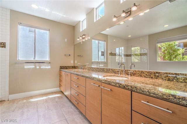 1448 Canyon Ledge Ct, Las Vegas, NV 89117 - full bathroom with healthy amount of natural light, double vanity, a tile shower, and tile patterned floors