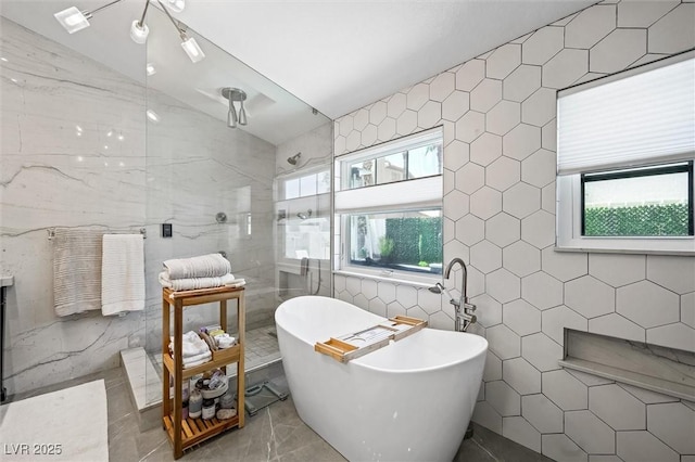 211 Kokopelli Ct, Henderson, NV 89074 - full bathroom with tile walls, healthy amount of natural light, a freestanding bath, and walk in shower