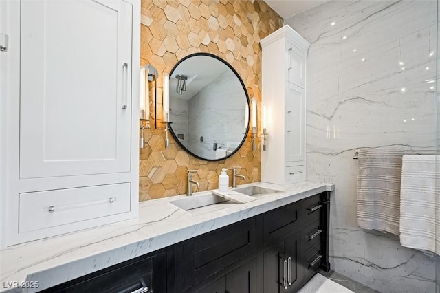 211 Kokopelli Ct, Henderson, NV 89074 - full bathroom featuring double vanity, tasteful backsplash, and marble tiled floors