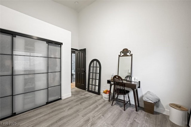 211 Kokopelli Ct, Henderson, NV 89074 - bedroom featuring wood finished floors, baseboards, and a high ceiling