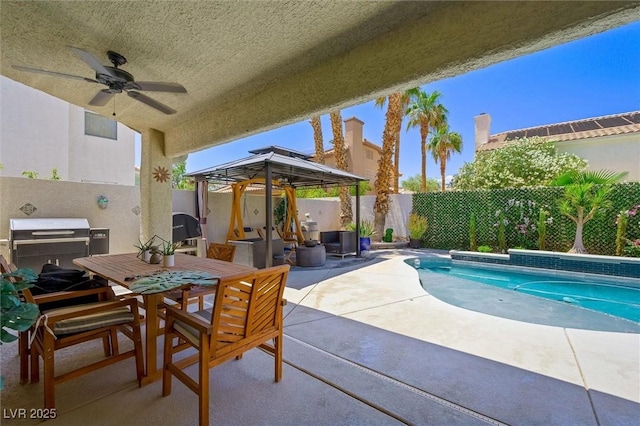 211 Kokopelli Ct, Henderson, NV 89074 - fenced backyard featuring a gazebo, a ceiling fan, a patio, and outdoor dining space