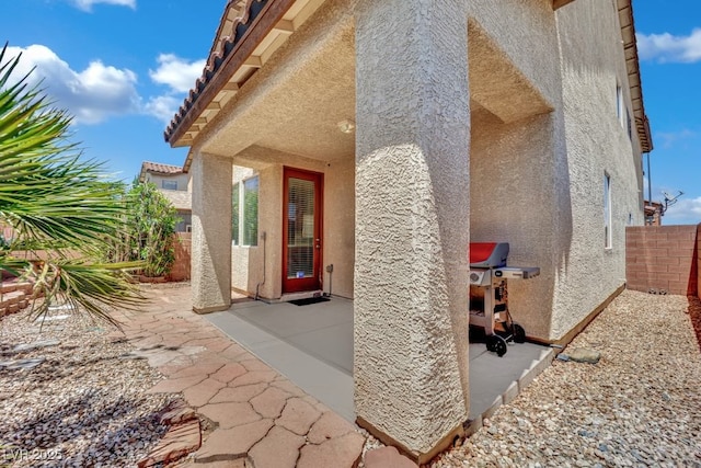 11787 Fern Creek Ln, Las Vegas, NV 89183 - entrance to property with stucco siding, a patio area, and a tile roof