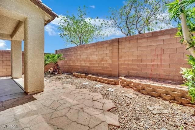 11787 Fern Creek Ln, Las Vegas, NV 89183 - fenced backyard with a patio