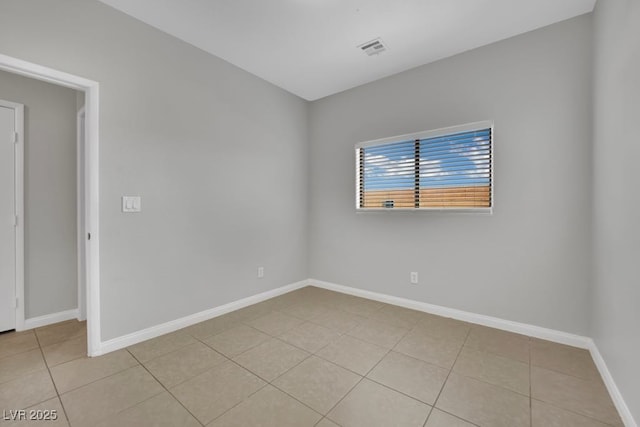 11787 Fern Creek Ln, Las Vegas, NV 89183 - empty room with light tile patterned floors and baseboards