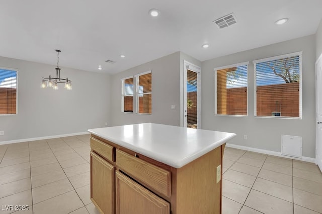 11787 Fern Creek Ln, Las Vegas, NV 89183 - kitchen with light tile patterned floors, a chandelier, a center island, recessed lighting, and light countertops