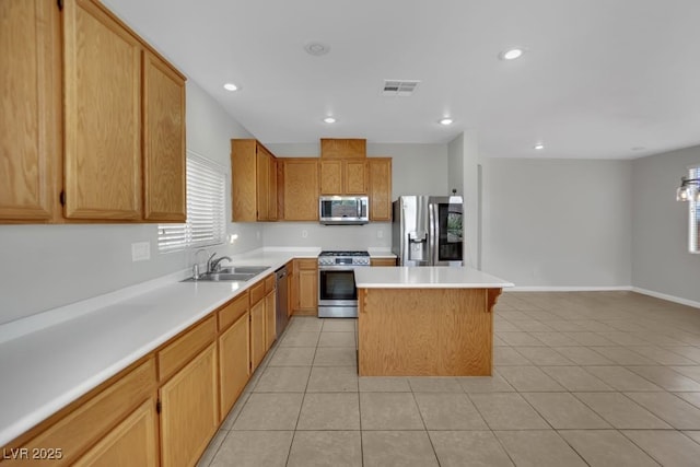 11787 Fern Creek Ln, Las Vegas, NV 89183 - kitchen with stainless steel appliances, a sink, a center island, light countertops, and light tile patterned floors