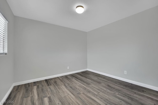 11787 Fern Creek Ln, Las Vegas, NV 89183 - empty room with dark wood finished floors and baseboards