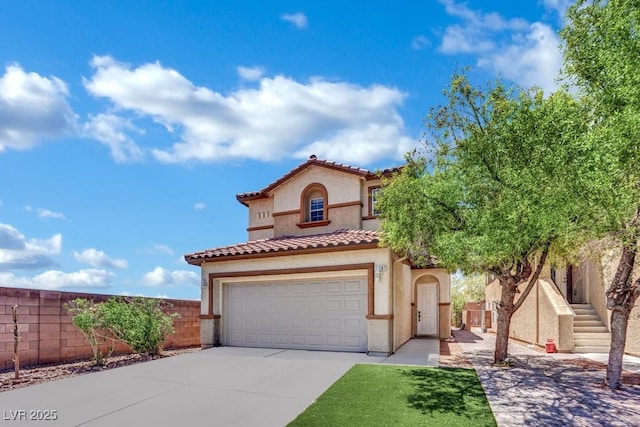 11787 Fern Creek Ln, Las Vegas, NV 89183 - mediterranean / spanish-style house featuring stucco siding, driveway, a tiled roof, and a garage