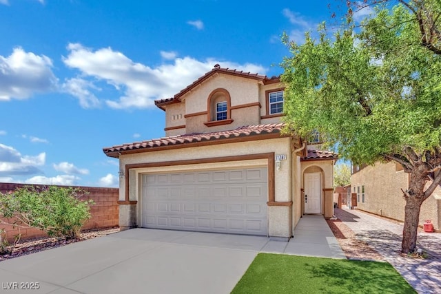 11787 Fern Creek Ln, Las Vegas, NV 89183 - mediterranean / spanish home featuring a tiled roof, driveway, stucco siding, and an attached garage