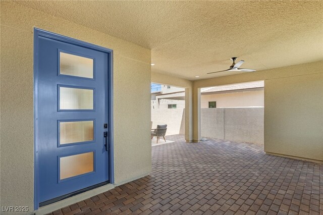 2578 Skylark Trail St, Henderson, NV 89044 - doorway to property featuring a patio area, ceiling fan, and stucco siding