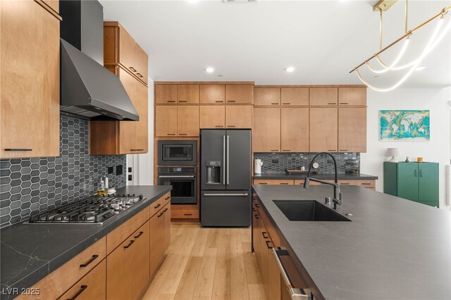 2578 Skylark Trail St, Henderson, NV 89044 - kitchen with black appliances, a sink, wall chimney exhaust hood, dark countertops, and light wood-style flooring