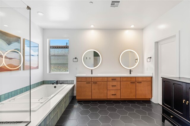 2578 Skylark Trail St, Henderson, NV 89044 - bathroom featuring double vanity, a bath, tile patterned floors, and recessed lighting
