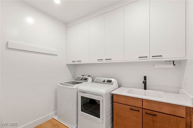 2578 Skylark Trail St, Henderson, NV 89044 - laundry room with washer and clothes dryer, cabinet space, baseboards, light wood-type flooring, and recessed lighting