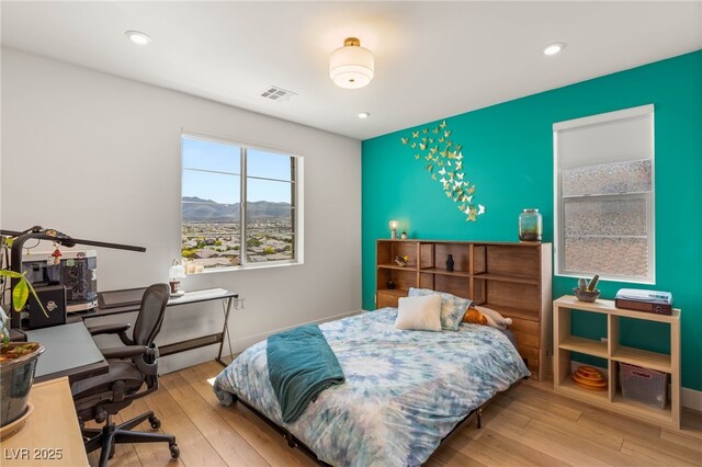 2578 Skylark Trail St, Henderson, NV 89044 - bedroom featuring hardwood / wood-style flooring, an office area, a mountain view, and recessed lighting