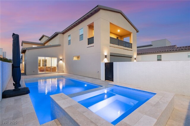 2578 Skylark Trail St, Henderson, NV 89044 - pool at dusk with a patio area and a pool with connected hot tub