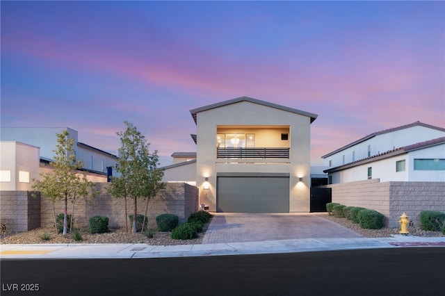 2578 Skylark Trail St, Henderson, NV 89044 - modern home with a balcony, stucco siding, an attached garage, and decorative driveway