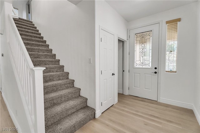 576 Foster Springs Rd, Las Vegas, NV 89148 - entrance foyer featuring stairway, light wood-style floors, and baseboards