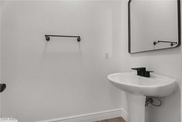 576 Foster Springs Rd, Las Vegas, NV 89148 - bathroom featuring baseboards and a sink