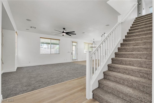 576 Foster Springs Rd, Las Vegas, NV 89148 - staircase with wood finished floors, a ceiling fan, baseboards, and a chandelier