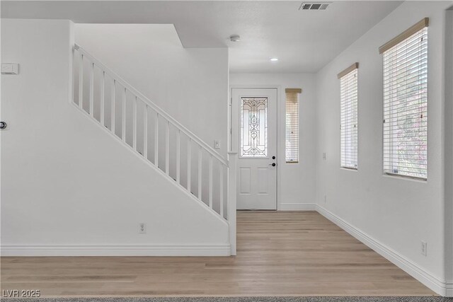 576 Foster Springs Rd, Las Vegas, NV 89148 - entryway with wood finished floors, baseboards, plenty of natural light, stairs, and recessed lighting