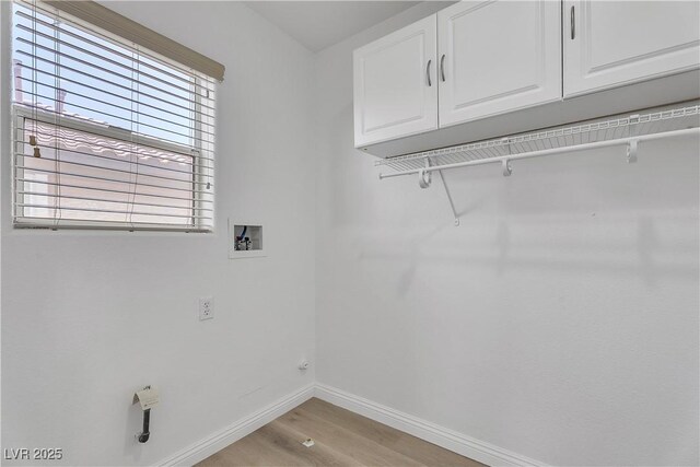 576 Foster Springs Rd, Las Vegas, NV 89148 - laundry area featuring washer hookup, baseboards, cabinet space, and light wood-style flooring