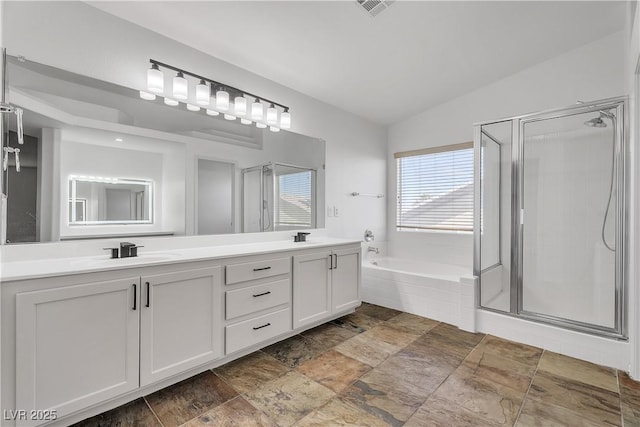 576 Foster Springs Rd, Las Vegas, NV 89148 - bathroom featuring double vanity, a garden tub, a stall shower, lofted ceiling, and stone finish flooring