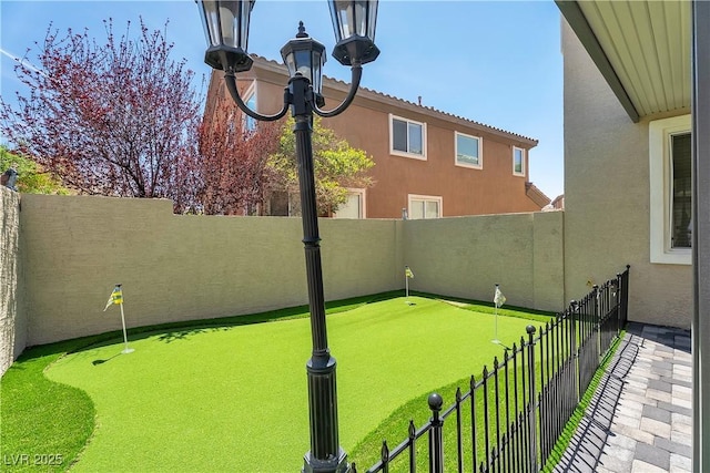 576 Foster Springs Rd, Las Vegas, NV 89148 - fenced backyard featuring a putting area