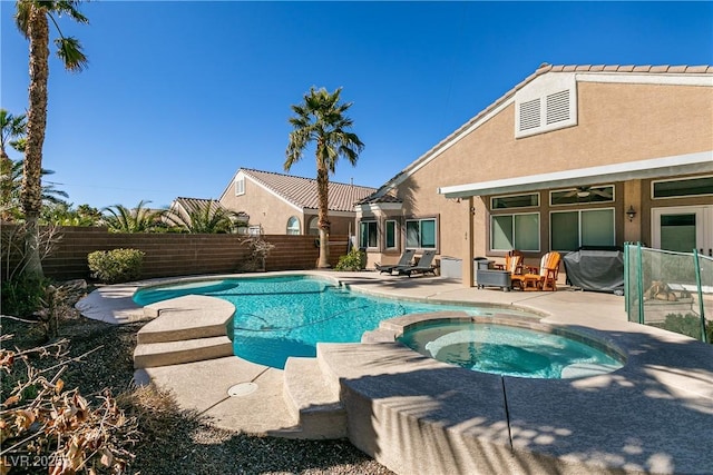 2713 Tanagrine Dr, North Las Vegas, NV 89084 - view of swimming pool with a patio area, a fenced backyard, and a pool with connected hot tub