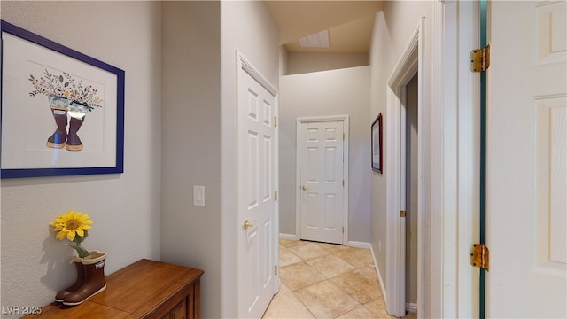 2713 Tanagrine Dr, North Las Vegas, NV 89084 - corridor with light tile patterned floors and baseboards