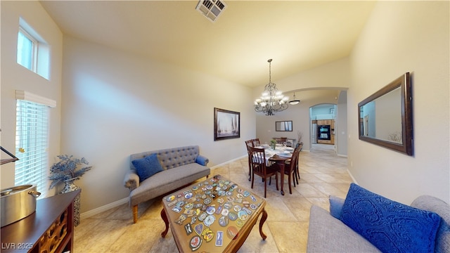 2713 Tanagrine Dr, North Las Vegas, NV 89084 - dining room featuring arched walkways, a chandelier, baseboards, and light tile patterned floors