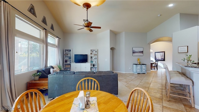 2713 Tanagrine Dr, North Las Vegas, NV 89084 - dining area featuring arched walkways, a ceiling fan, recessed lighting, baseboards, and high vaulted ceiling