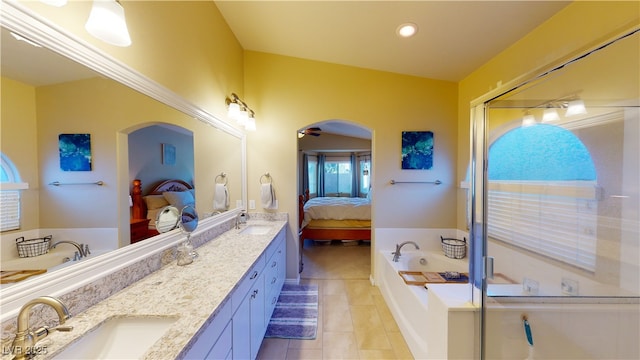 2713 Tanagrine Dr, North Las Vegas, NV 89084 - ensuite bathroom with double vanity, tile patterned flooring, a bath, a stall shower, and recessed lighting