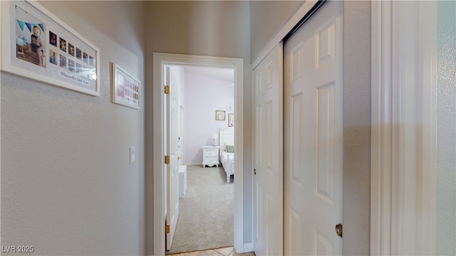 2713 Tanagrine Dr, North Las Vegas, NV 89084 - hall featuring light colored carpet and a textured wall