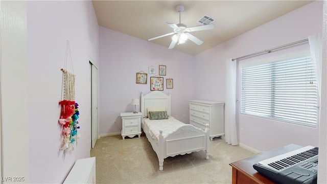 2713 Tanagrine Dr, North Las Vegas, NV 89084 - bedroom with light colored carpet, baseboards, and a ceiling fan