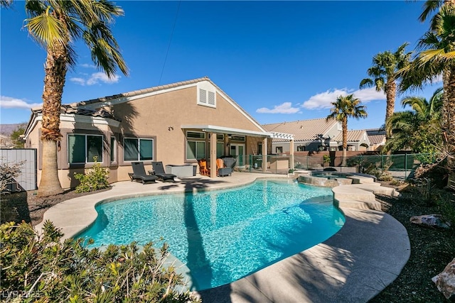 2713 Tanagrine Dr, North Las Vegas, NV 89084 - view of pool with a fenced backyard, a patio area, and a pool with connected hot tub