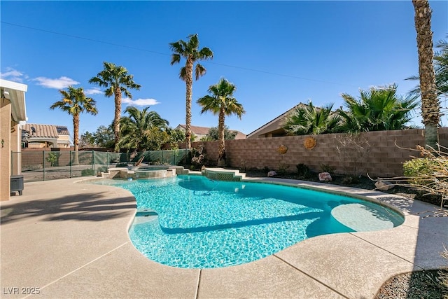 2713 Tanagrine Dr, North Las Vegas, NV 89084 - view of pool featuring a fenced backyard, a patio area, and a pool with connected hot tub