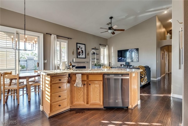 3088 Paseo Mountain Ave, Henderson, NV 89052 - kitchen featuring stainless steel dishwasher, open floor plan, a chandelier, a ceiling fan, and dark wood finished floors