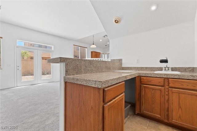3273 Alcudia Bay Ave, Las Vegas, NV 89141 - kitchen with a sink, brown cabinetry, healthy amount of natural light, and recessed lighting