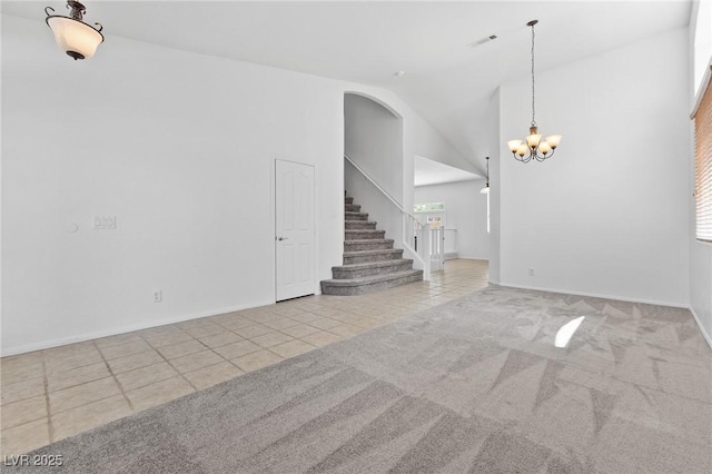 3273 Alcudia Bay Ave, Las Vegas, NV 89141 - unfurnished living room featuring tile patterned floors, a chandelier, stairway, carpet, and baseboards