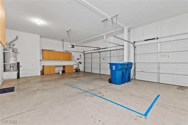 3273 Alcudia Bay Ave, Las Vegas, NV 89141 - garage with water heater and a garage door opener