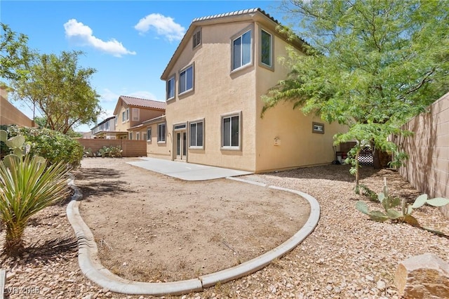 3273 Alcudia Bay Ave, Las Vegas, NV 89141 - back of house featuring stucco siding, a patio, and a fenced backyard