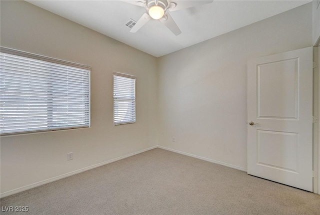 5244 Fiery Sky Ridge St, Las Vegas, NV 89148 - spare room with light carpet, a ceiling fan, and baseboards