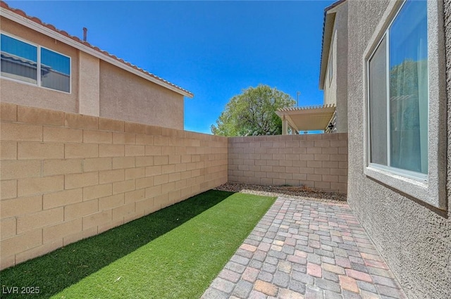 5244 Fiery Sky Ridge St, Las Vegas, NV 89148 - fenced backyard with a patio