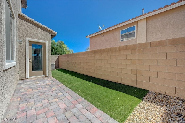 5244 Fiery Sky Ridge St, Las Vegas, NV 89148 - fenced backyard with a patio area
