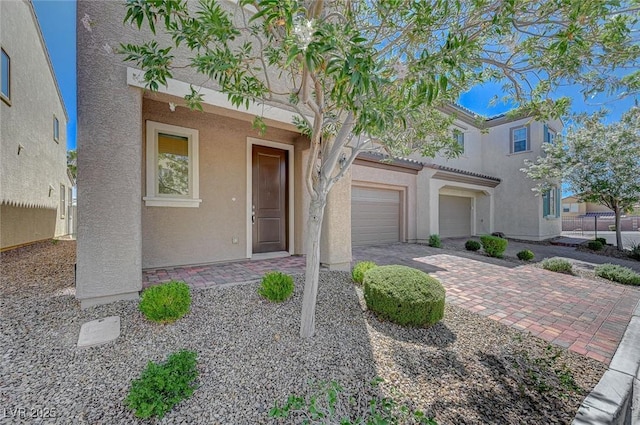 5244 Fiery Sky Ridge St, Las Vegas, NV 89148 - view of front of property with stucco siding and driveway